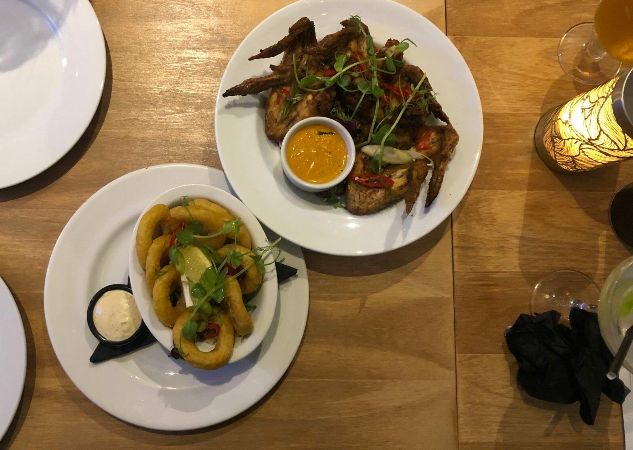 the overhead shot of the chicken wings and battered calamari