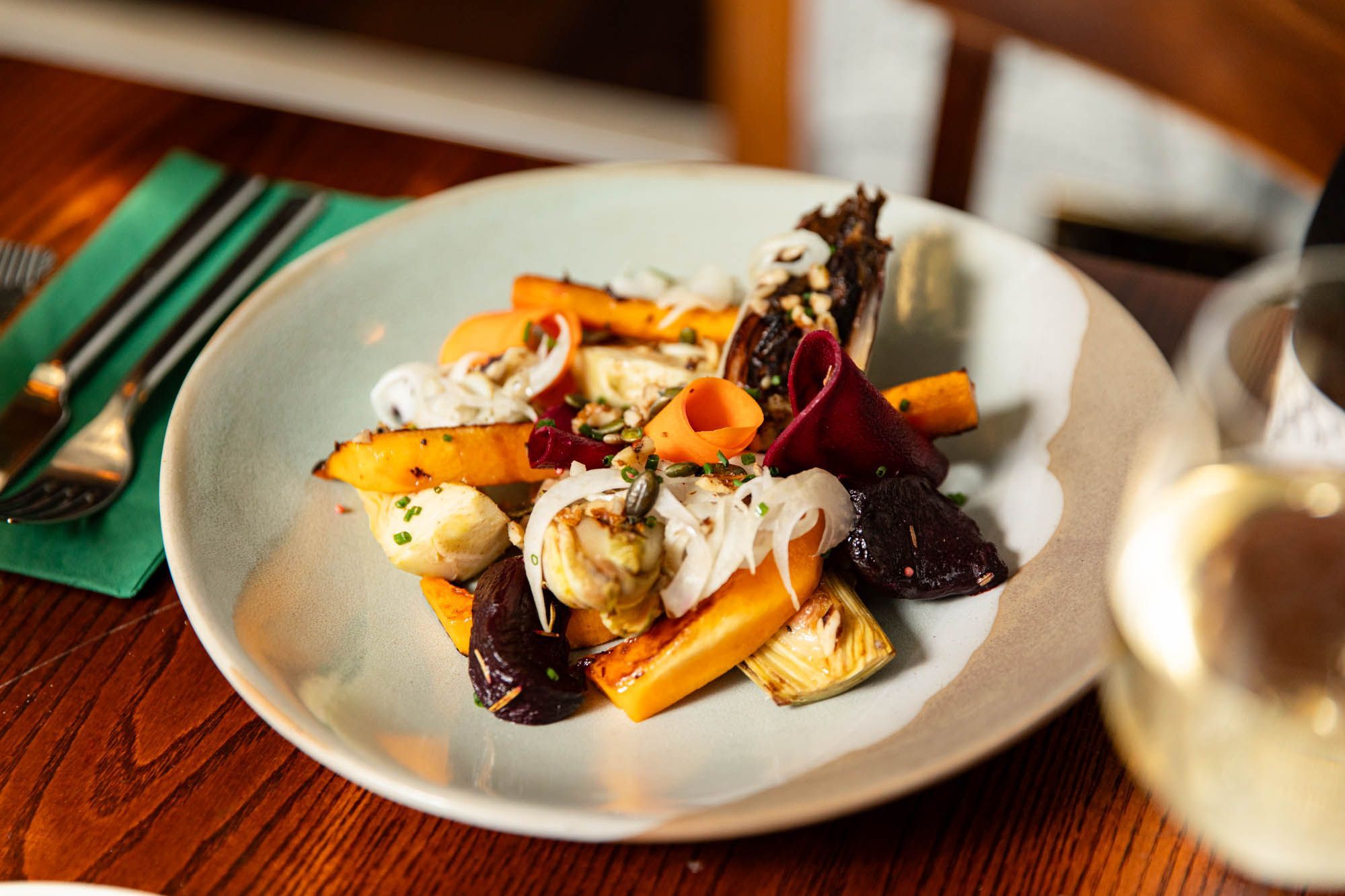 Charred artichoke, bok choy and roast carrots with a sprinkle of crushed walnuts