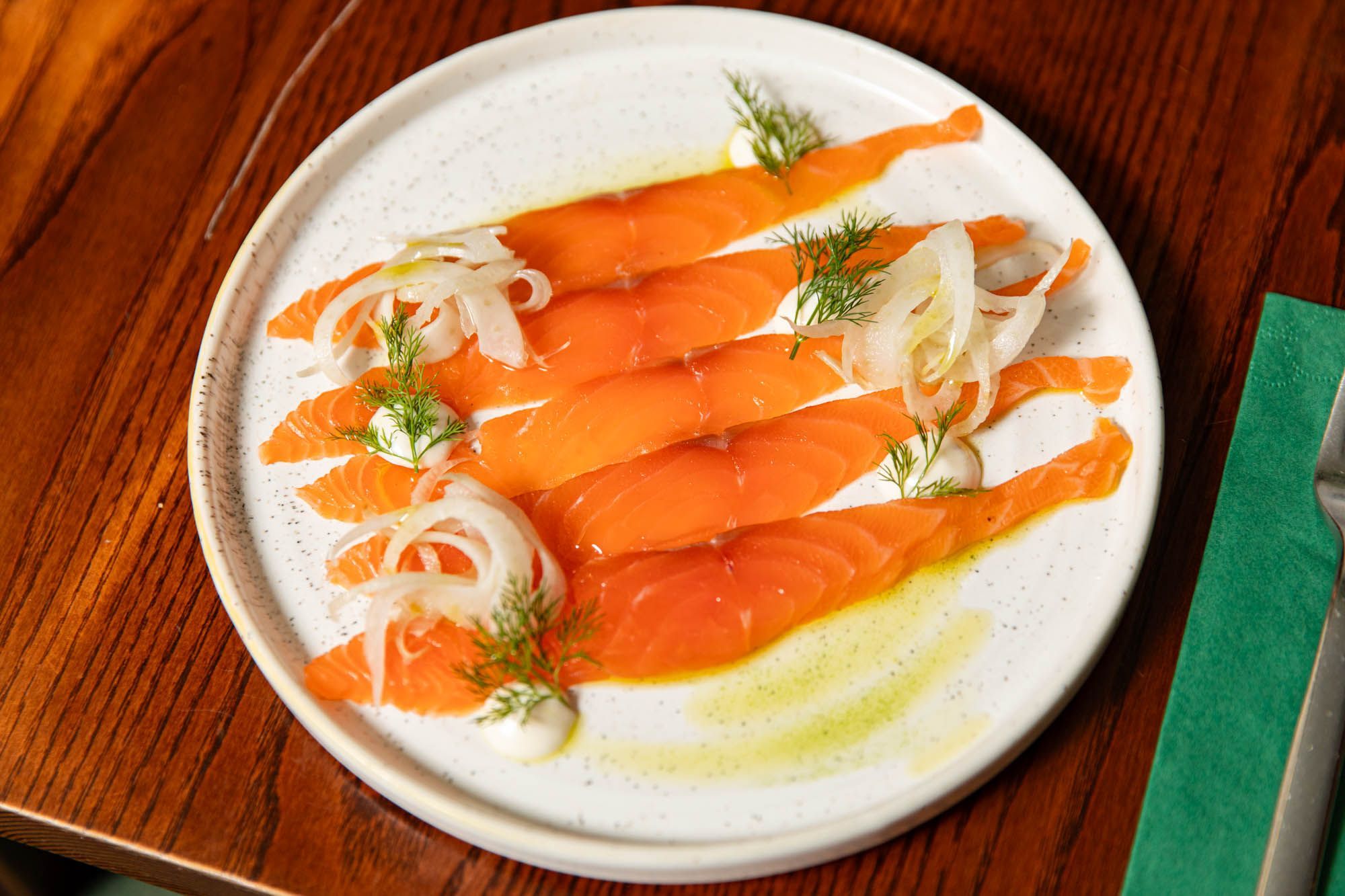 Overhead shot of the smoked salmon served on a white plate. Cosy evening in Hove Place pub