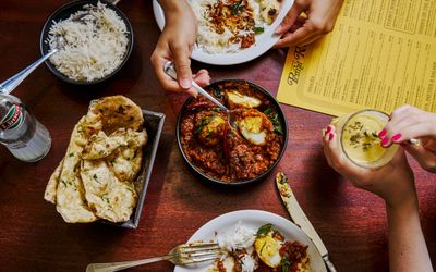 over head shot of the two people enjoying food and drinks at the Permit Room Brighton