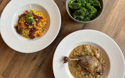 over head shot of the main dishes at the Chimney House, including Confit Duck and the Pearl Barley Risotto. Autumnal feast