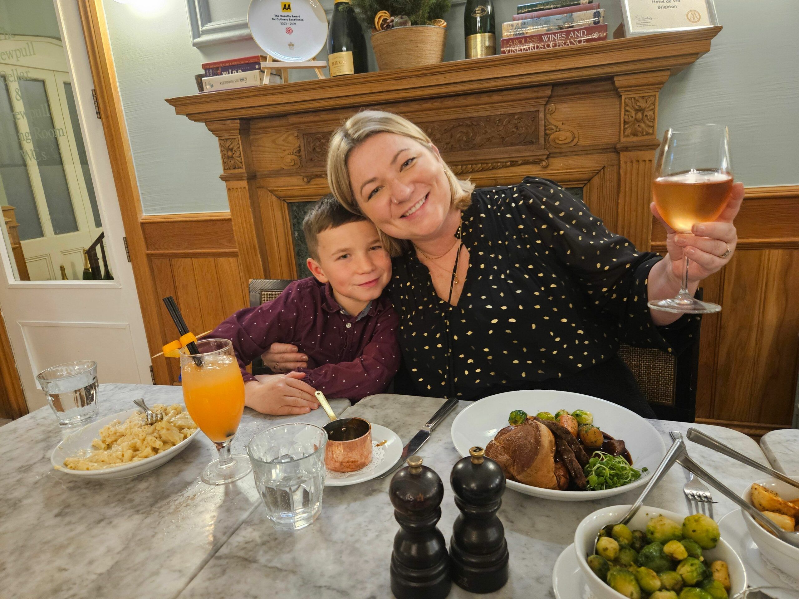 Brittany and her son enjoying Sunday roast lunch with drinks. Family dining at Hotel Du Vin 