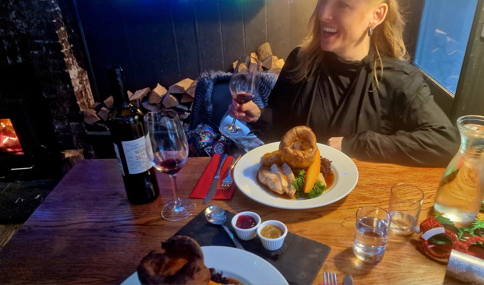Jess friend enjoying her glass of red wine together with Sunday roast  delight at The New Inn.