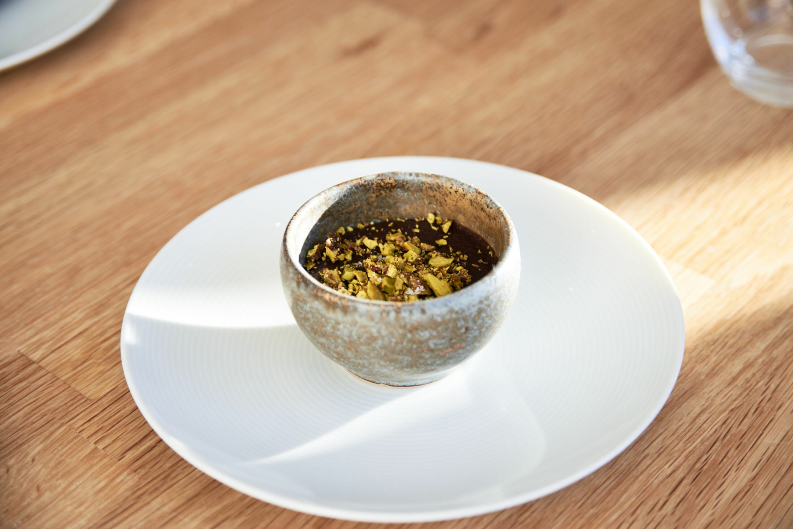 Hot Valhrona 70% Chocolate pudding  with pistachios in the top. Simple and delicious lunch menu at The Little Fish