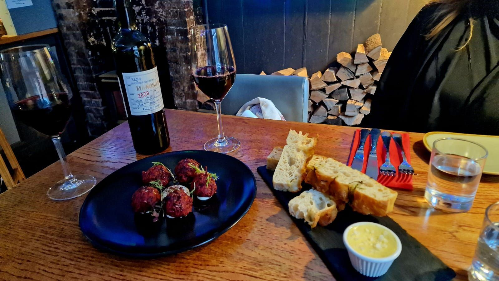brown table laid out with delicious apetisers served on the blue plates  including ruby red Beetroot and Cauliflower Fritters. Roast delight at the New Inn Hurstpierpoint blog