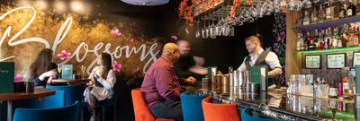 shot of the bar area at the Blossoms bar and restaurant in Brighton. People enjoying cocktails in beautifully decorated bar