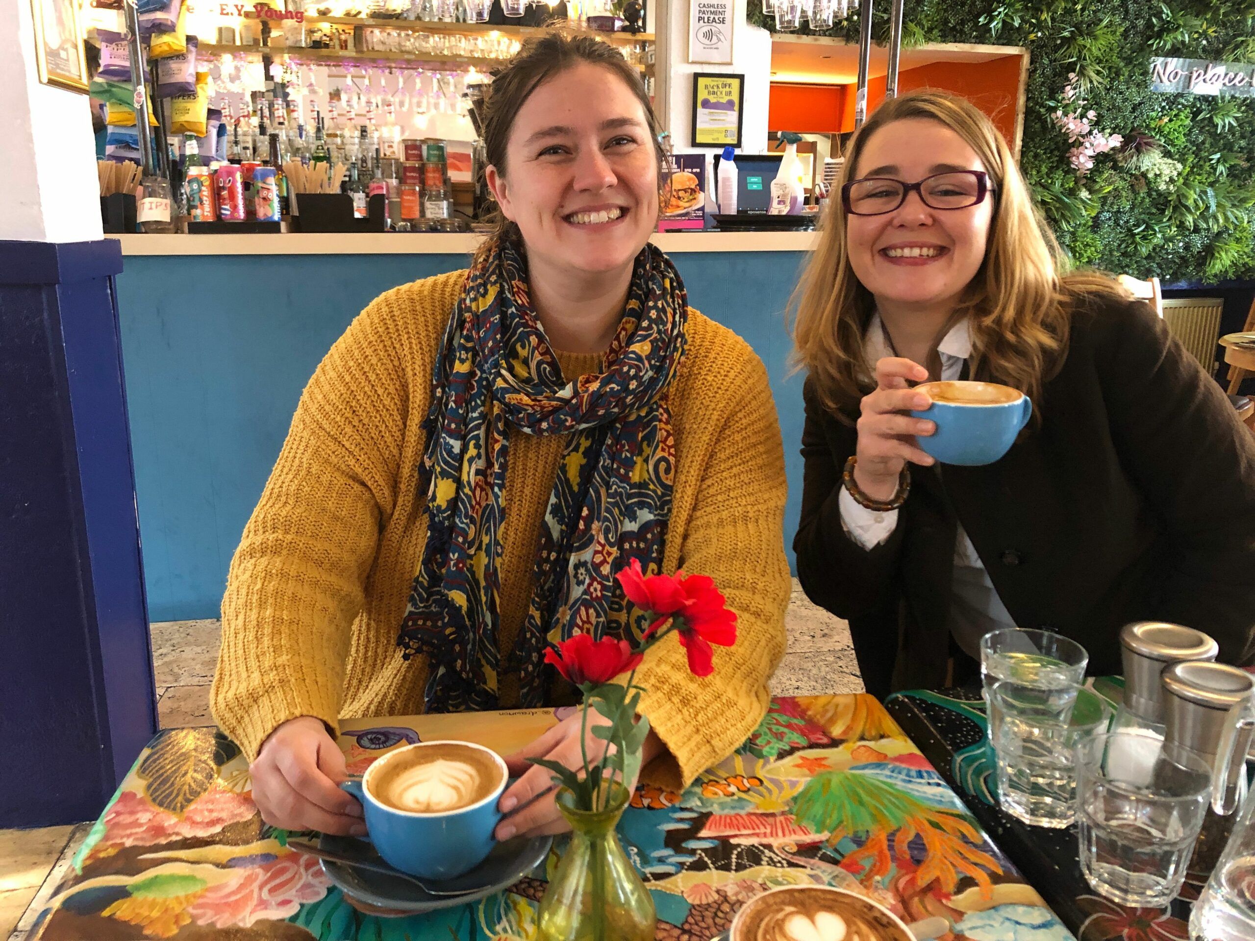 Megan and her friend enjoying their coffees at Arcobaleno. No Brunch like Arco