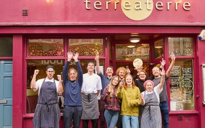 The best restaurant in Brighton in 2024. Team Terre a Terre celebrate their first placed finish in the Brighton Restaurant Awards 2024. All the team are cheering outside their brightly coloured venue on little East Street in Brighton. The public decided this vote and gave the title of best restaurant to this venue which has been around some 30+ years.