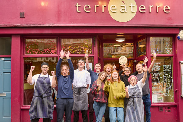 The best restaurant in Brighton in 2024. Team Terre a Terre celebrate their first placed finish in the Brighton Restaurant Awards 2024. All the team are cheering outside their brightly coloured venue on little East Street in Brighton. The public decided this vote and gave the title of best restaurant to this venue which has been around some 30+ years.