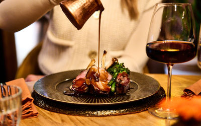 Gravy being poured of lamb at Terra Restaurant, Tottington Manor.