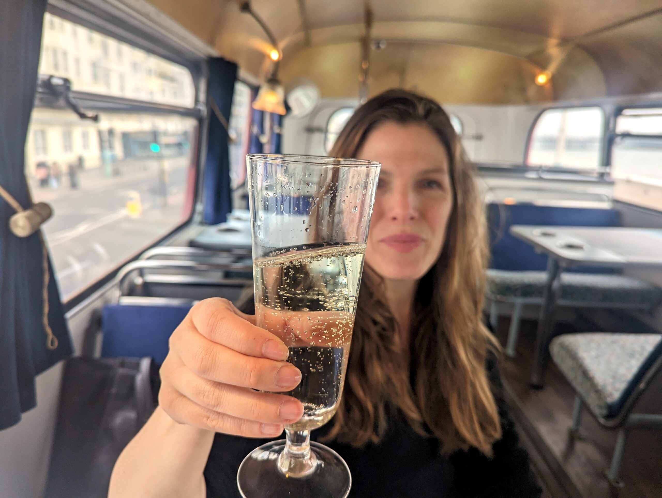 Hannah holding a glass of Prosecco