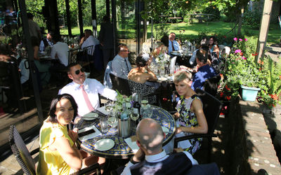 Guests enjoying the wedding breakfast in the garden at the Jolly Sportsman in East Chiltington