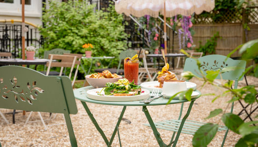 Alfresco dining at Oeuf in Hove in a pretty garden. Oeuf are frequently the best venue for brunch at the Brighton Restaurant Awards. Hove cafe with hidden courtyard.