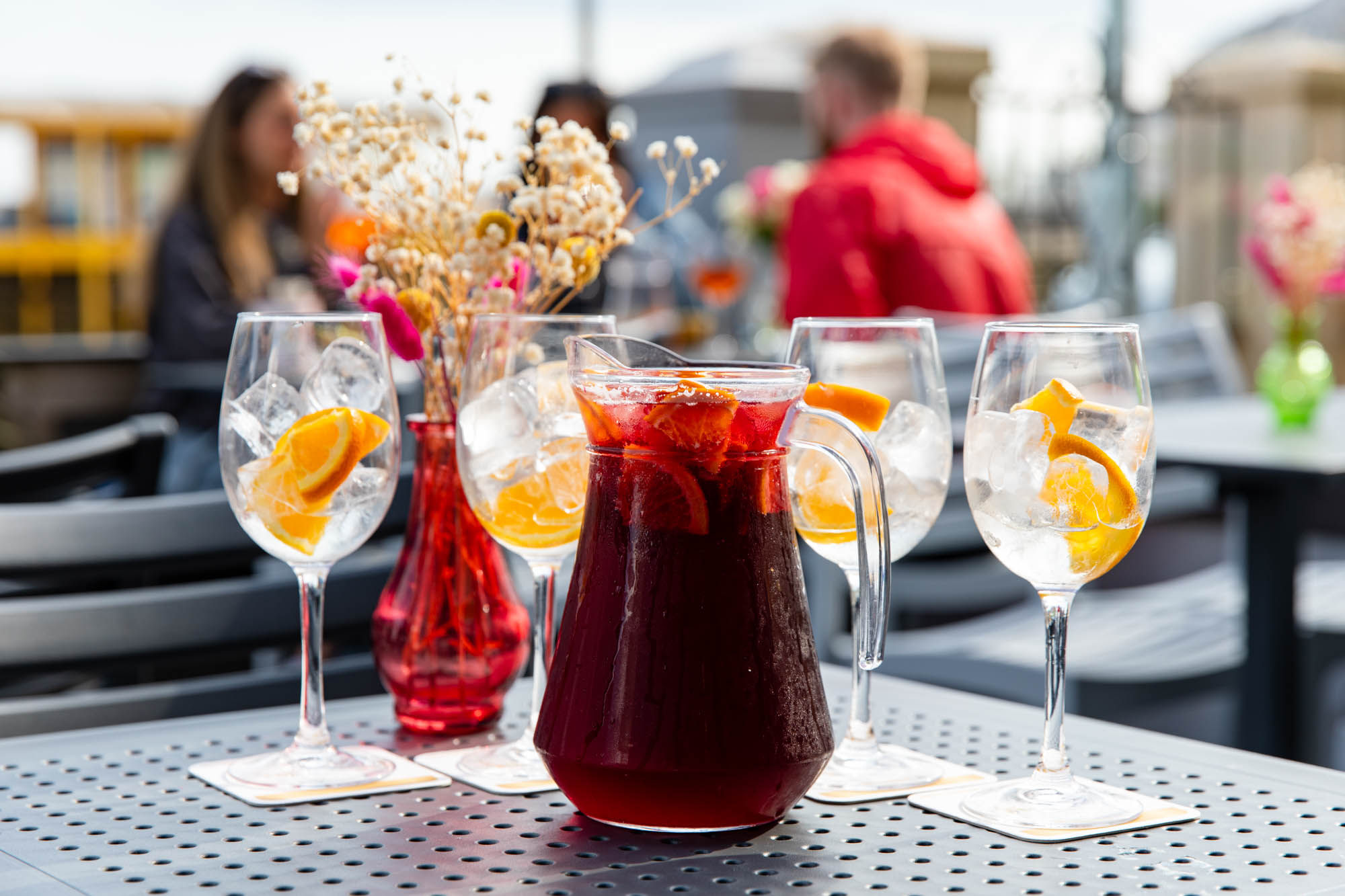 carafe with juice and glasses served on the terrace table at Beach House