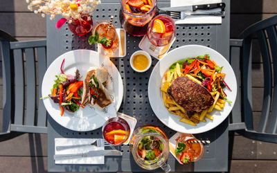 over head shot of the Beach House dishes and drinks served on the terrace table