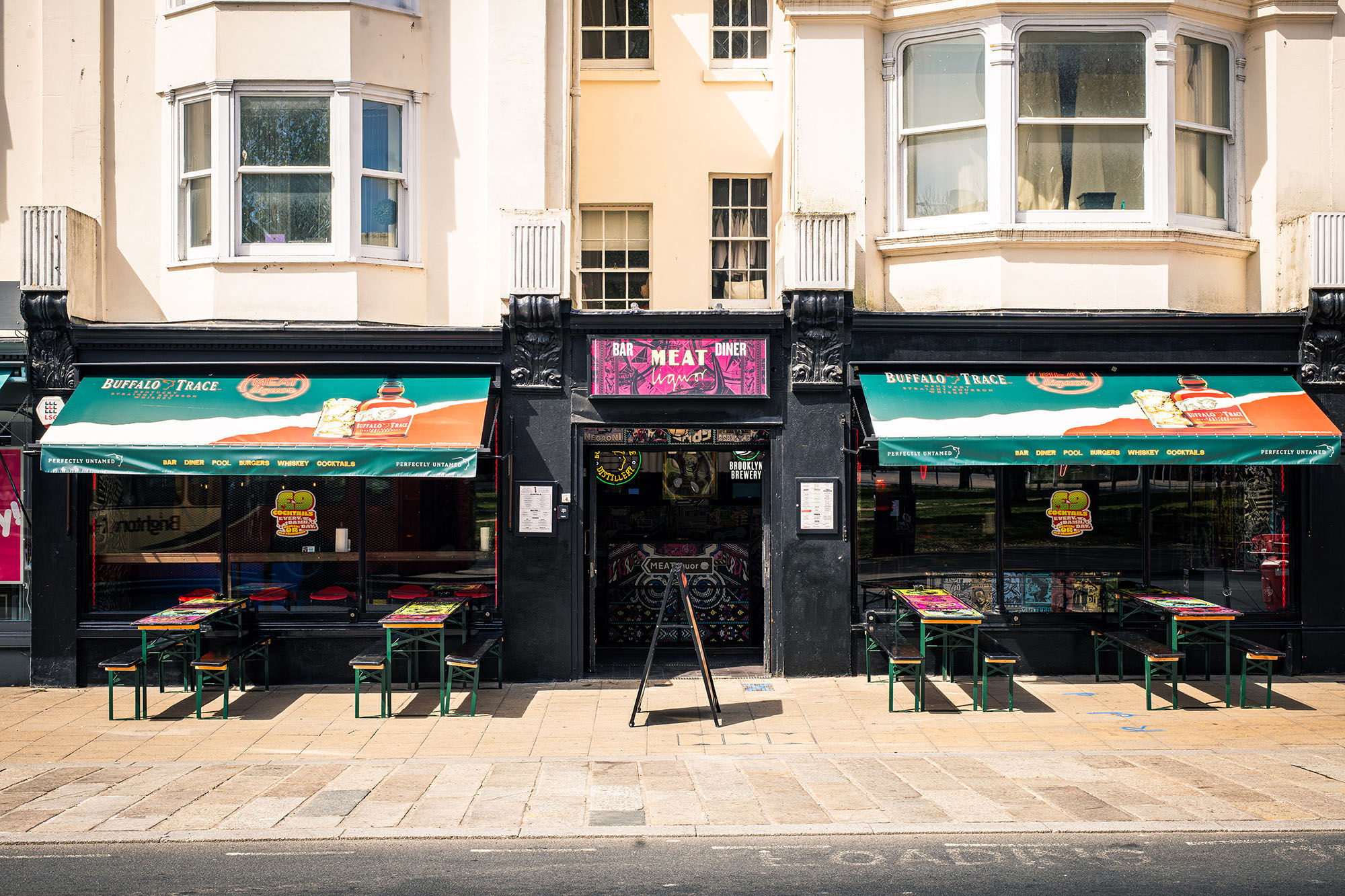 The exterior of MEATliquor on a sunny day with the alfresco seating.