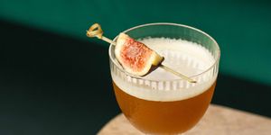 close up shot of the cocktail with the fig on the stick on the top of it at Burnt Orange in Brighton. Placed as runner up in the best cocktails in Brighton category in the 2025 BRAVO Awards.