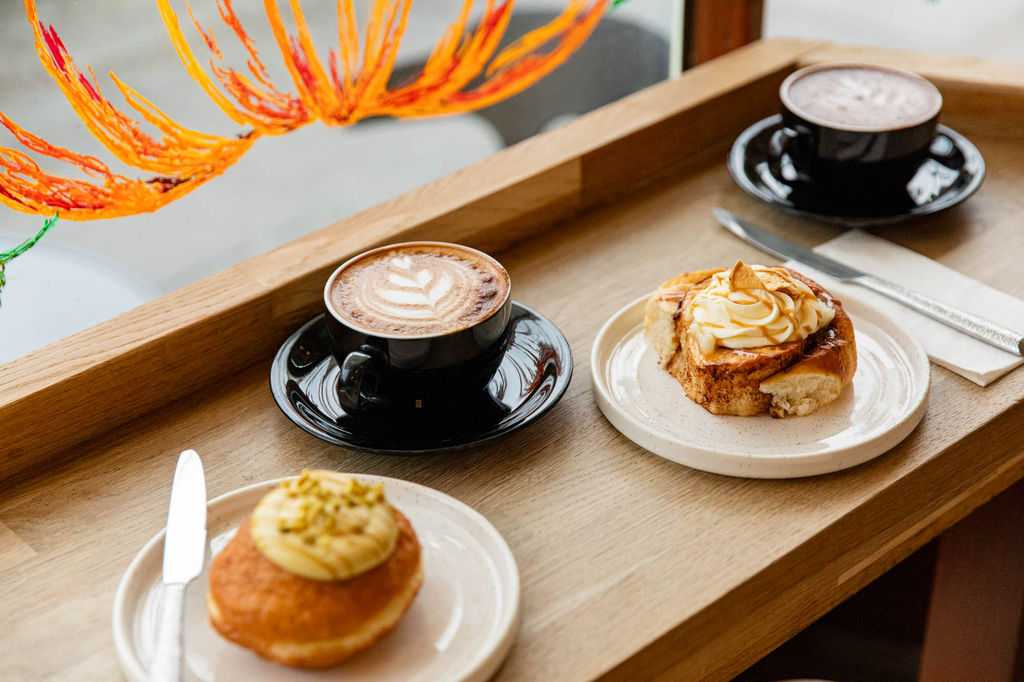 window seat, two coffees and pastry at the bayon bakery