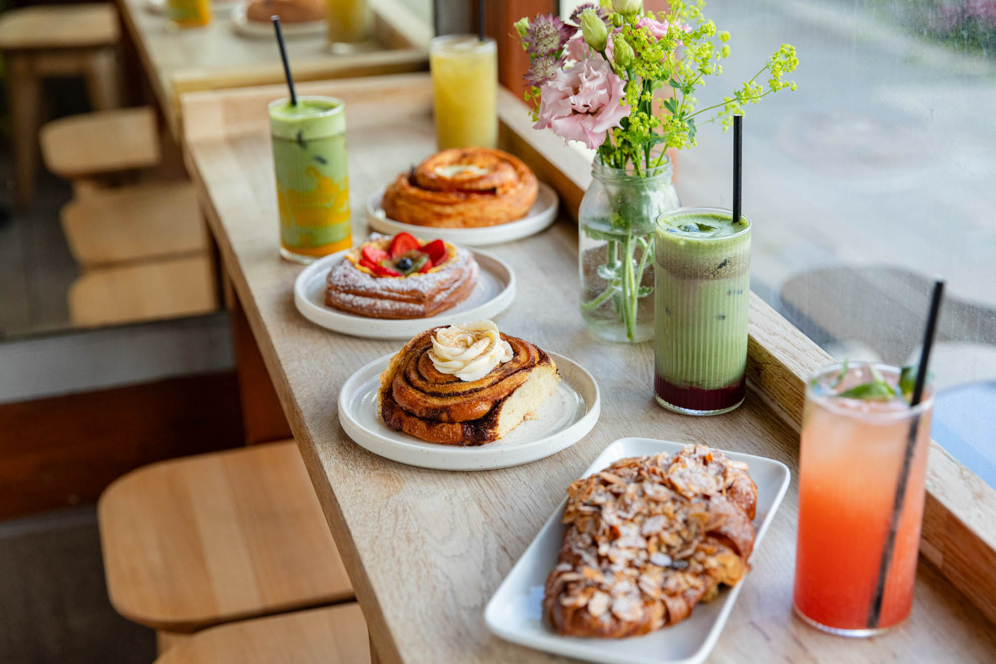 window seating at the Bayon Bakery, table laid out with pastries and drinks