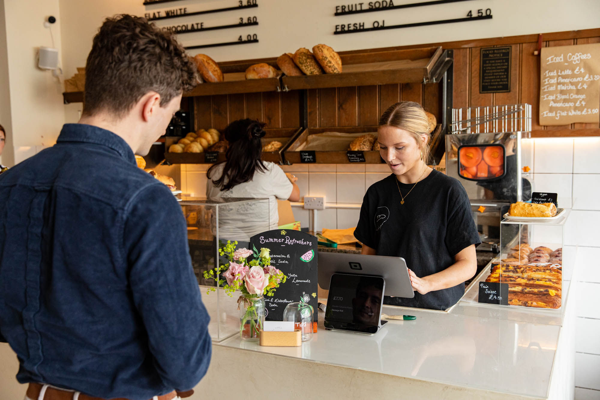 waiter and customer at Bayon Bakery