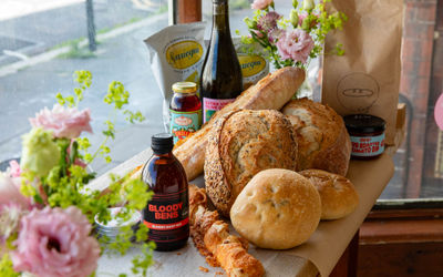 couple of breads in the corner with drink bottles