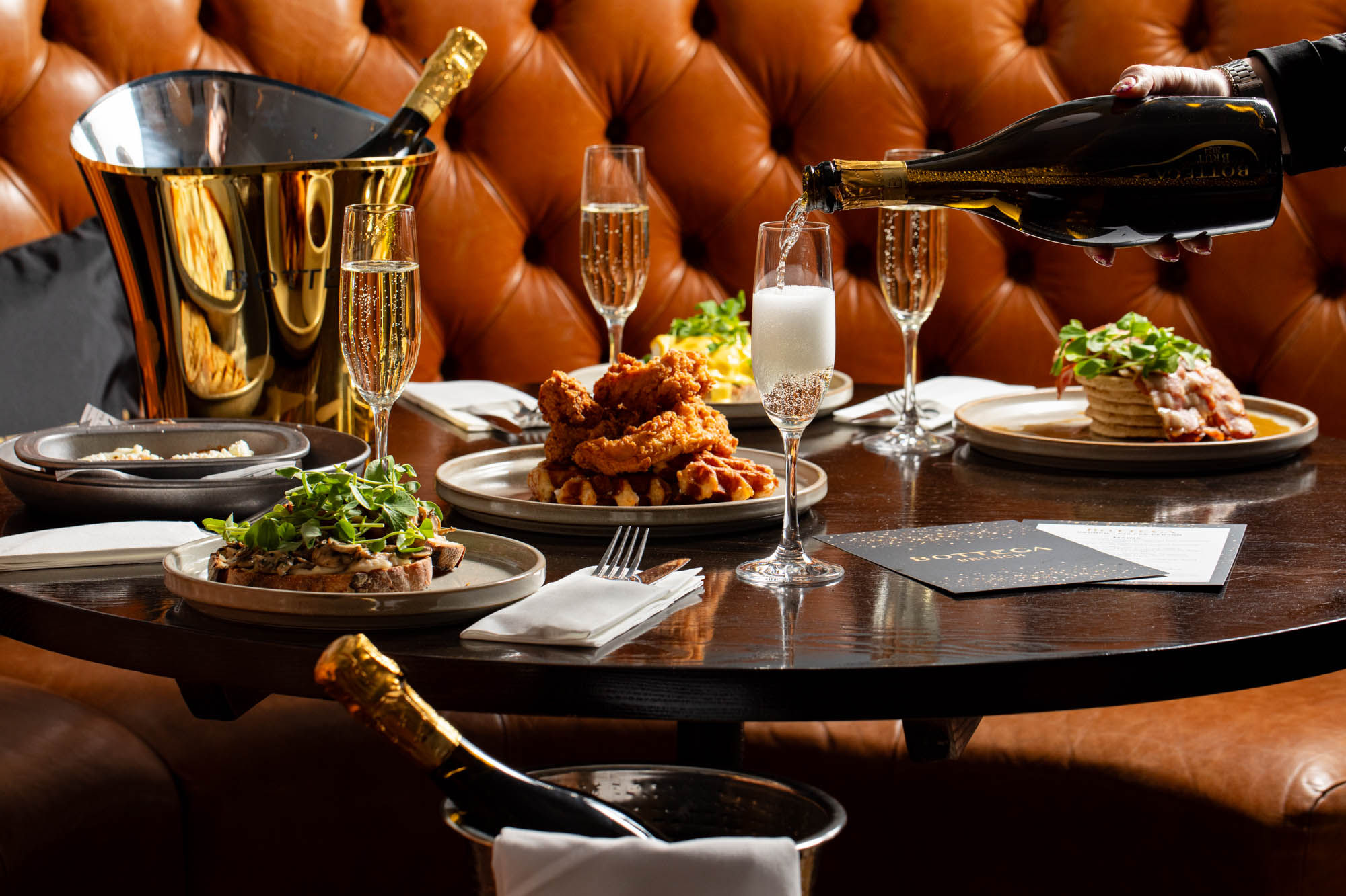 Bottega x Metropole Bar - Bottomles brunch collaboration. Waiter sipping Bottega drink in glass