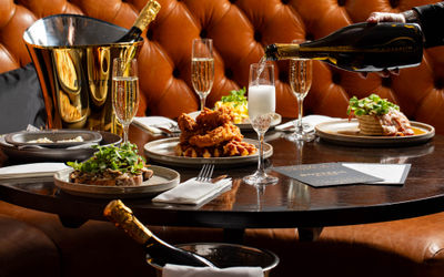 Bottega x Metropole Bar - Bottomles brunch collaboration. Waiter sipping Bottega drink in glass