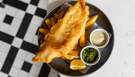 a plate of fish and chops