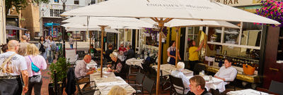 exterior shot of terrace at English's of Brighton populated with people enjoying their food and drinks. No.9 among Brighton's Best Restaurants at the BRAVO Awards 2026. Located close to Riddle and Finns