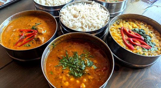 traditional tiffins with a fun roulette (total pot luck) of two curries (you choose meat, vegetarian, or vegan) with rice to share