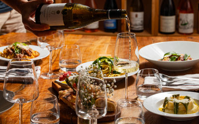 person sipping wine in the glass