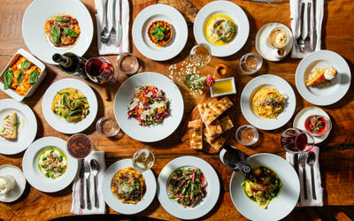 over head shot of the table full of the dishes from the new menu at Poco