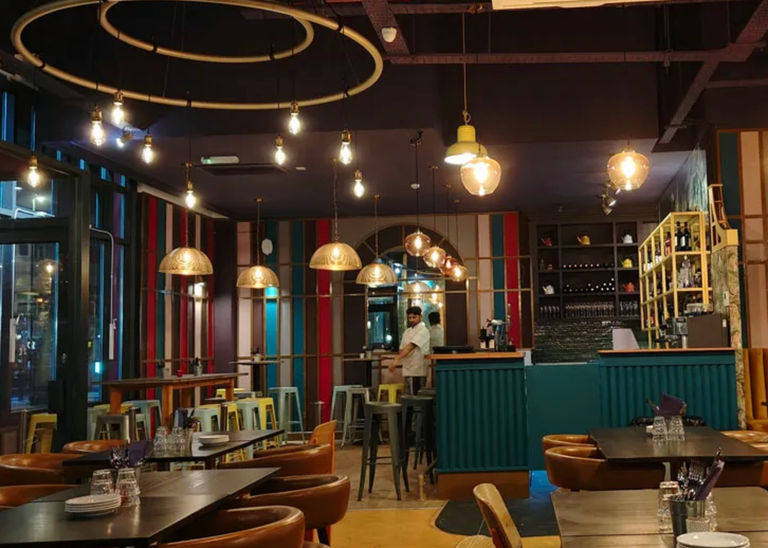 Part of our Indian restaurant Brighton guide. This is Jamun Indian restaurant on West Street close to the cinema. Inside a soft glow of lights and blue banquet seating with a bar in the corner.