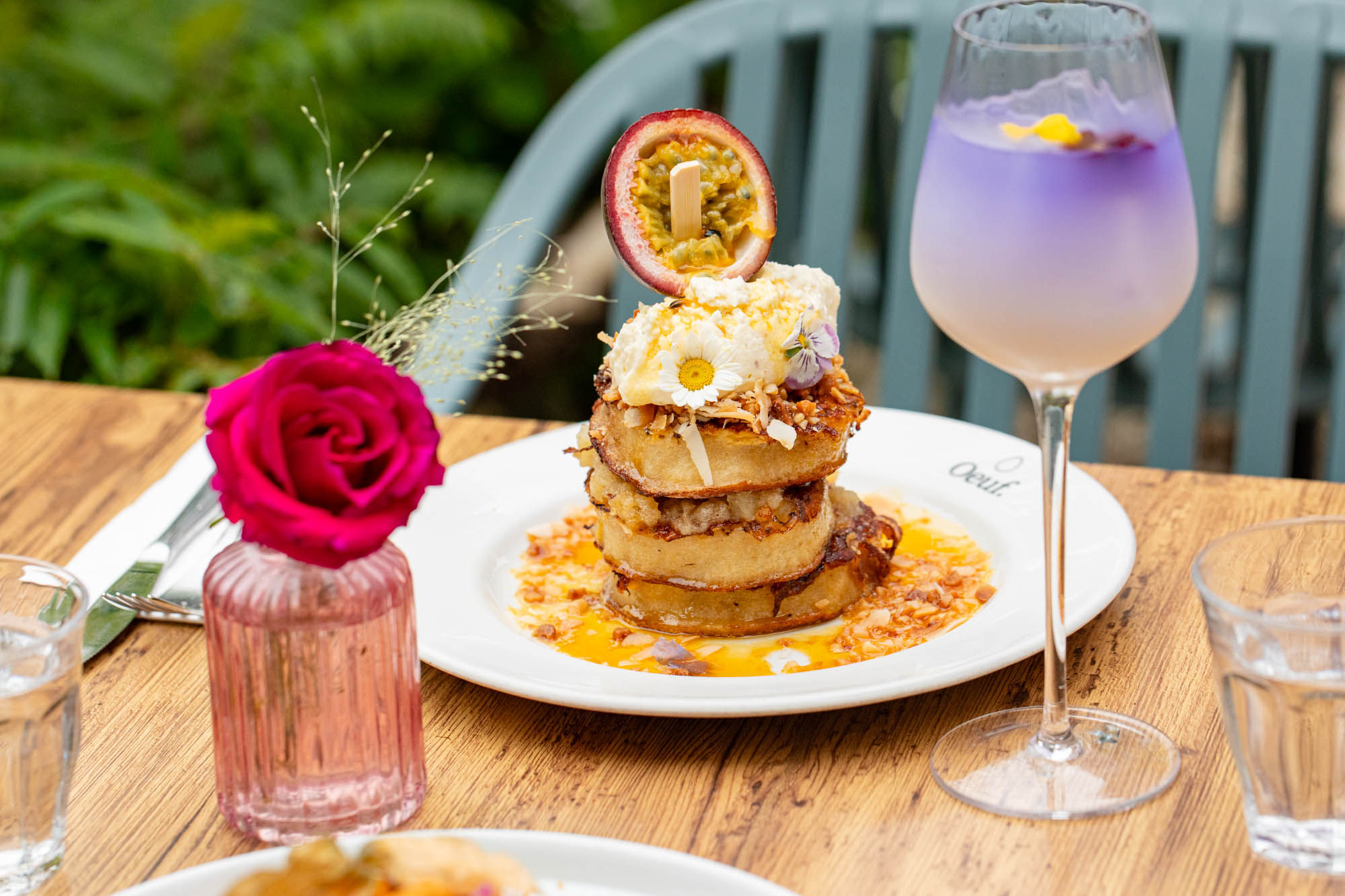 close shot of the Oeuf frumpets served with purple drink