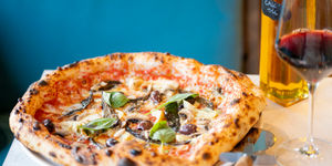shot of the delicious looking pizza at Village Pizza Kitchen