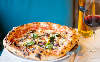 shot of the delicious looking pizza at Village Pizza Kitchen