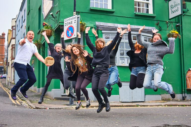 The Robin Hood team jumping in front of the pub and celebrating Best Brighton Pub win in 2025 BRAVO awards