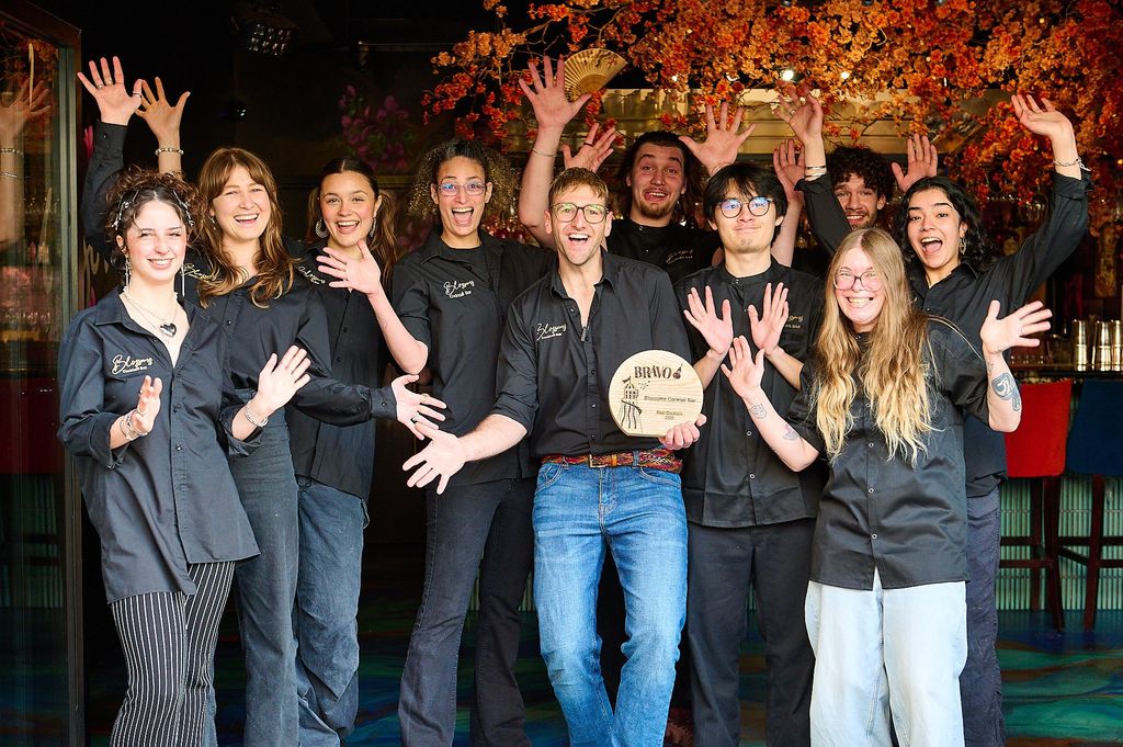 Blossoms Bar team holding celebrating their BRAVO Best Cocktail Win, Sammy holding BRAVO trophy. the best cocktail bar in Brighton 2025