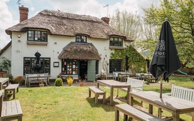 the Ginger Fox in Henfield . Thatched roof and garden
