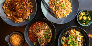 over head shot of the four dishes at Shaaxni Brighton including various types of noodles