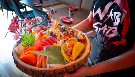 Things to do in Brighton for couples. A colourful sharing platter at Wabi Sabi in Hove featuring all teh colours of the rainbow.