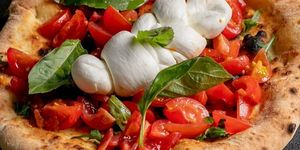 close up shot of pizza with mozzarella. VIP Pizza is located in central Brighton, close to the pier and St Jame's Street