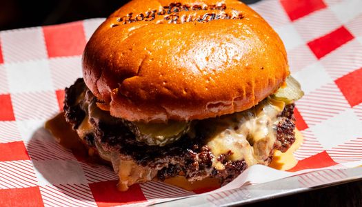 close up shot of the delicious meat burger served at Boysterous Burgers at The Fountain Head in Brighton
