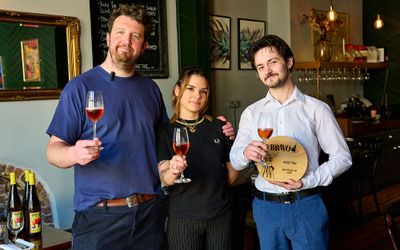 trio at Wild flor holding BRAVO Best Wine List trophy and each glass of bubbles. BRAVO best wine list 2025