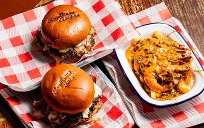 two delicious burgers with shrimps on the side at Boysterous Burgers