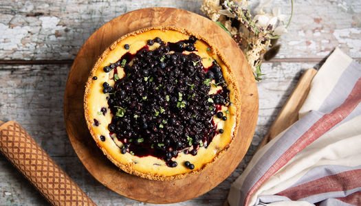 over head shot of the cheesecake with blueberries on the top served at Jacob's Bakery