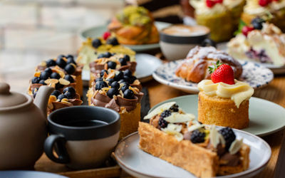 close up shot of few cakes and coffee