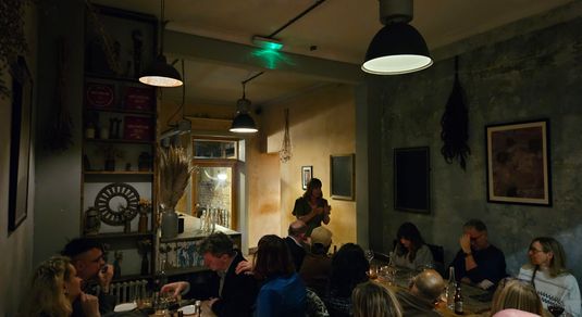 Wanderlust Supper Club at The Set, Cecily talking to participants of this supper club