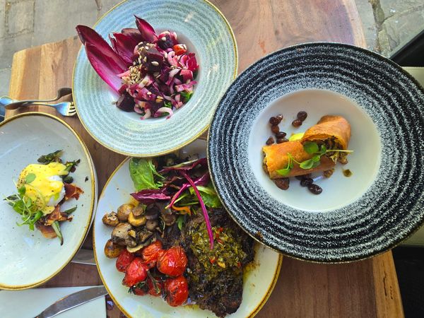 a over head shot of the table at Jolly Sportsman laid out with multiple dishes