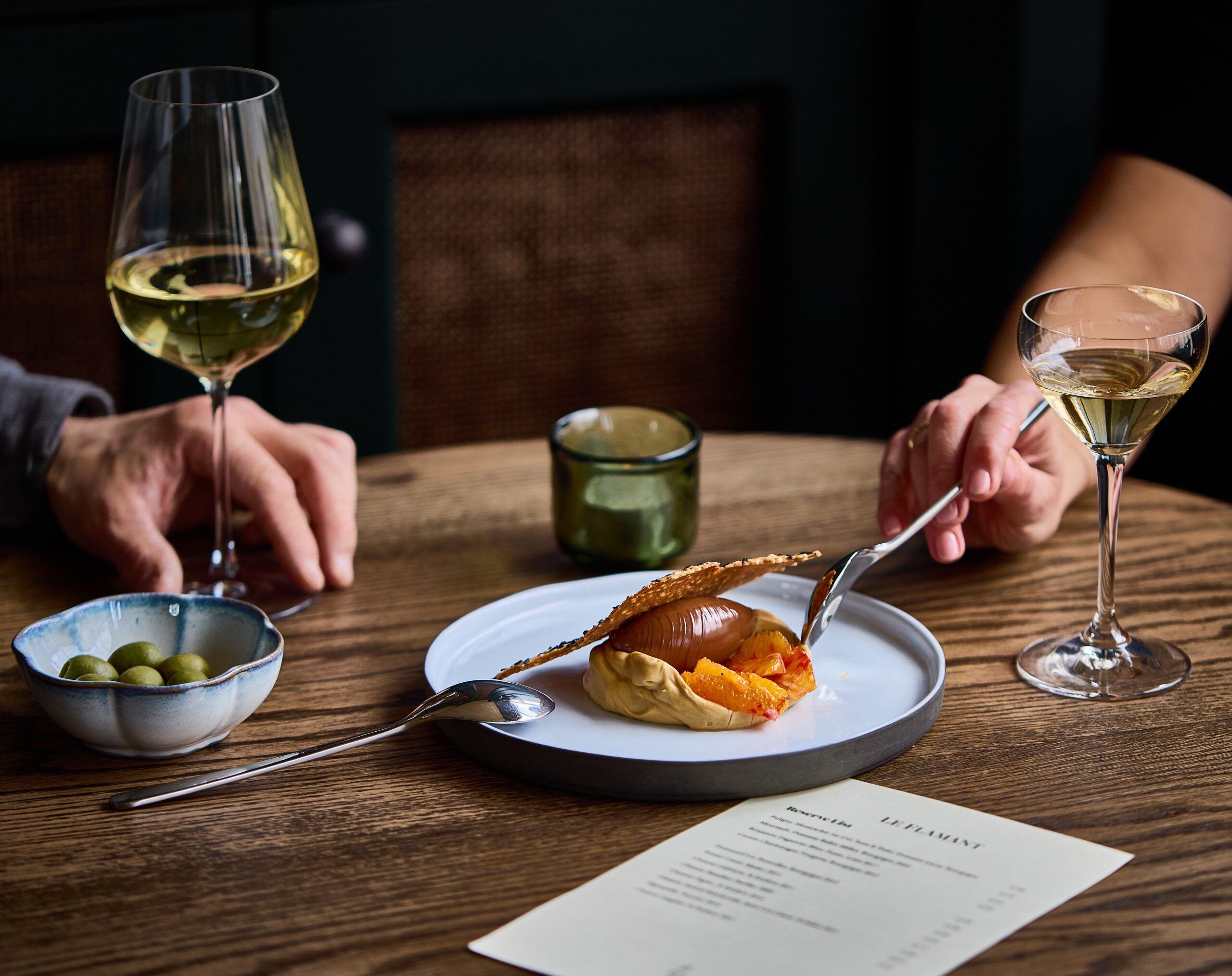 Dessert & Olives served with glasses of white wine 
